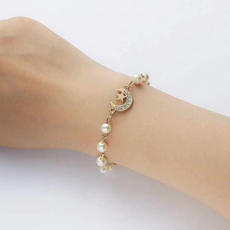 Hollow Rhinestone Pearl Bracelet Multi-style Adjustable $8.50 Dana Fashion Color: 8 Eyes Rhinestone Women's Accessories Product information: Treatment Process: Pearl Inlay Color: Cross, 8 words round, Moon XINGX, starfish, butterfly, heart-shaped wings, 8