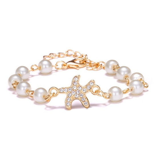 Hollow Rhinestone Pearl Bracelet Multi-style Adjustable $8.50 Dana Fashion Color: Starfish Women's Accessories Product information: Treatment Process: Pearl Inlay Color: Cross, 8 words round, Moon XINGX, starfish, butterfly, heart-shaped wings, 8 words Rh