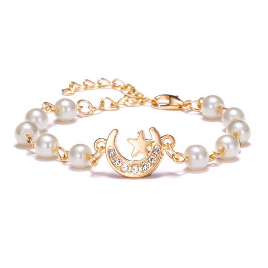 Hollow Rhinestone Pearl Bracelet Multi-style Adjustable $8.50 Dana Fashion Color: Moon XINGX Women's Accessories Product information: Treatment Process: Pearl Inlay Color: Cross, 8 words round, Moon XINGX, starfish, butterfly, heart-shaped wings, 8 words
