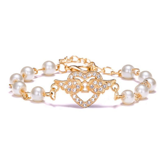 Hollow Rhinestone Pearl Bracelet Multi-style Adjustable $8.50 Dana Fashion Color: Heart Wings Women's Accessories Product information: Treatment Process: Pearl Inlay Color: Cross, 8 words round, Moon XINGX, starfish, butterfly, heart-shaped wings, 8 words