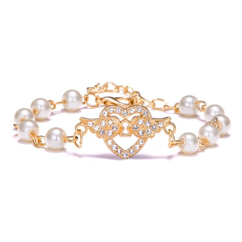 Hollow Rhinestone Pearl Bracelet Multi-style Adjustable $8.50 Dana Fashion Color: Heart Wings Women's Accessories Product information: Treatment Process: Pearl Inlay Color: Cross, 8 words round, Moon XINGX, starfish, butterfly, heart-shaped wings, 8 words