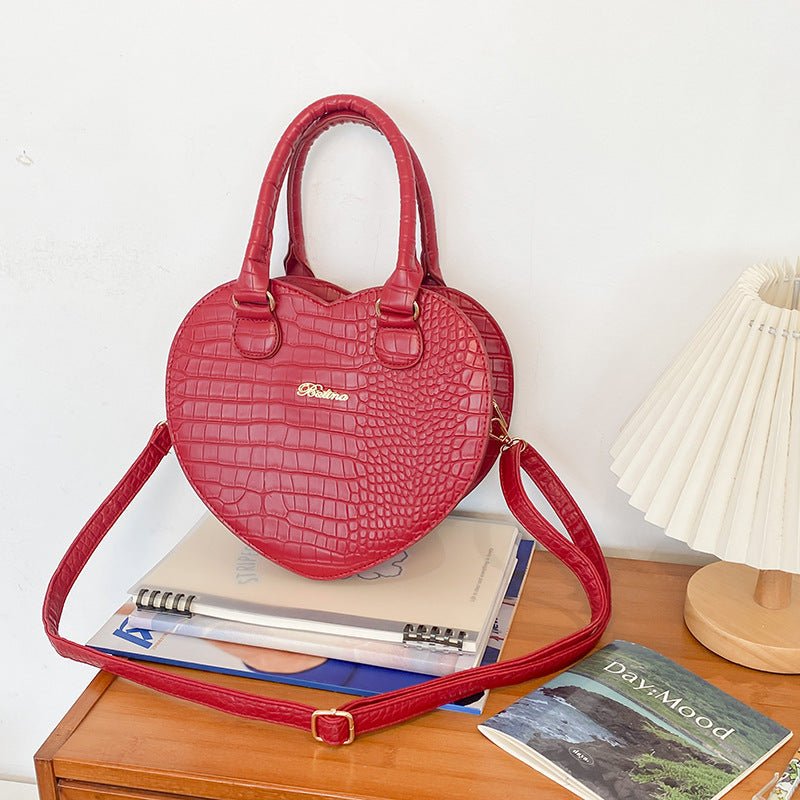 Hot Girl Style Handbag Pattern Love Shoulder Crossbody $43.44 Dana Fashion Color: Red Women's Bags Product information: Lining texture: PU Color: black, white, red Outer bag type: Sandwich pocket Material: PU Suitcase shape: heart shape Style: street tren