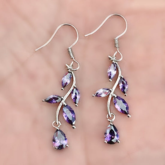 Inlaid Zircon Leaf-shaped Earrings $12.86 Dana Fashion Color: Purple Women's Accessories Product information: Color: white, red, purple, green Inlaid material: alloy inlaid artificial gemstone/semi-precious stone Style: Unisex Material: Copper Style: Nati