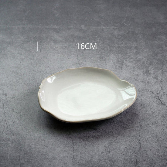 Irregular ceramic bowl dinner plate $30.07 Dana Fashion Color: Deep plate Dana's Kitchen Category: bowl, plate Material: Ceramic Features: Hand-made irregular shapes, the effect of combining white kiln glaze and loess, make every tableware look vivid and