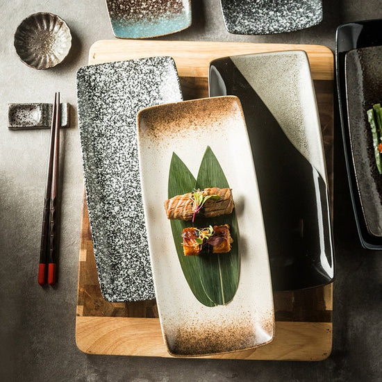 Japanese Ceramic Plates Sushi Dish Tableware Tray Cutlery $20.23 Dana Fashion style: 1 Style Dana's Kitchen Product information: Material: porcelain Style: Japanese Shape: rectangle Color classification: 1Style: 9-inch rectangular four-corner pangu plain