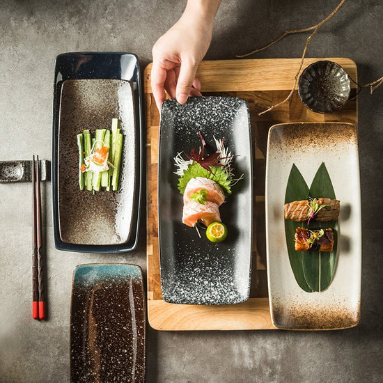 Japanese Ceramic Plates Sushi Dish Tableware Tray Cutlery $20.23 Dana Fashion style: 1 Style Dana's Kitchen Product information: Material: porcelain Style: Japanese Shape: rectangle Color classification: 1Style: 9-inch rectangular four-corner pangu plain