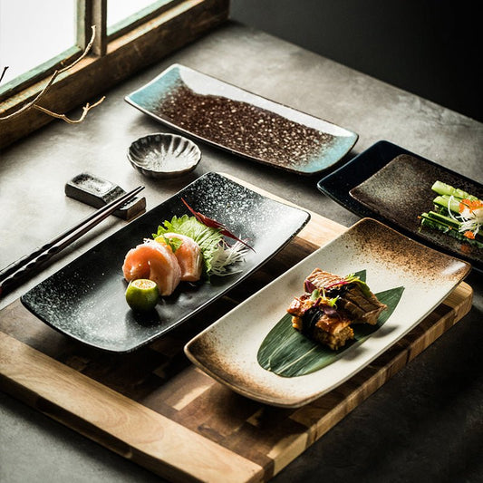 Japanese Ceramic Plates Sushi Dish Tableware Tray Cutlery $20.23 Dana Fashion style: 1 Style Dana's Kitchen Product information: Material: porcelain Style: Japanese Shape: rectangle Color classification: 1Style: 9-inch rectangular four-corner pangu plain