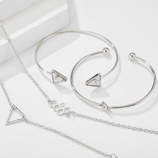 Knotted Triangle Honeycomb Four-piece Bracelet $15.00 Dana Fashion Color: Gold Women's Accessories Product information: Treatment Process: Electroplating Color: Gold Material: Alloy Popular elements: fu character Packing list: Four piece bracelet set * 1
