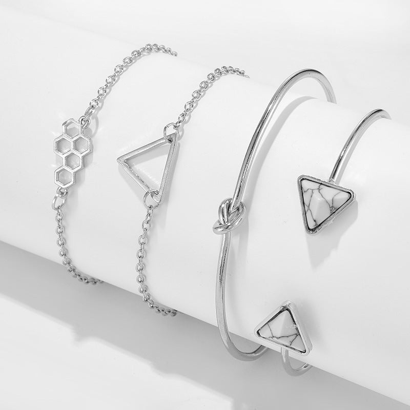Knotted Triangle Honeycomb Four-piece Bracelet $15.00 Dana Fashion Color: Gold Women's Accessories Product information: Treatment Process: Electroplating Color: Gold Material: Alloy Popular elements: fu character Packing list: Four piece bracelet set * 1