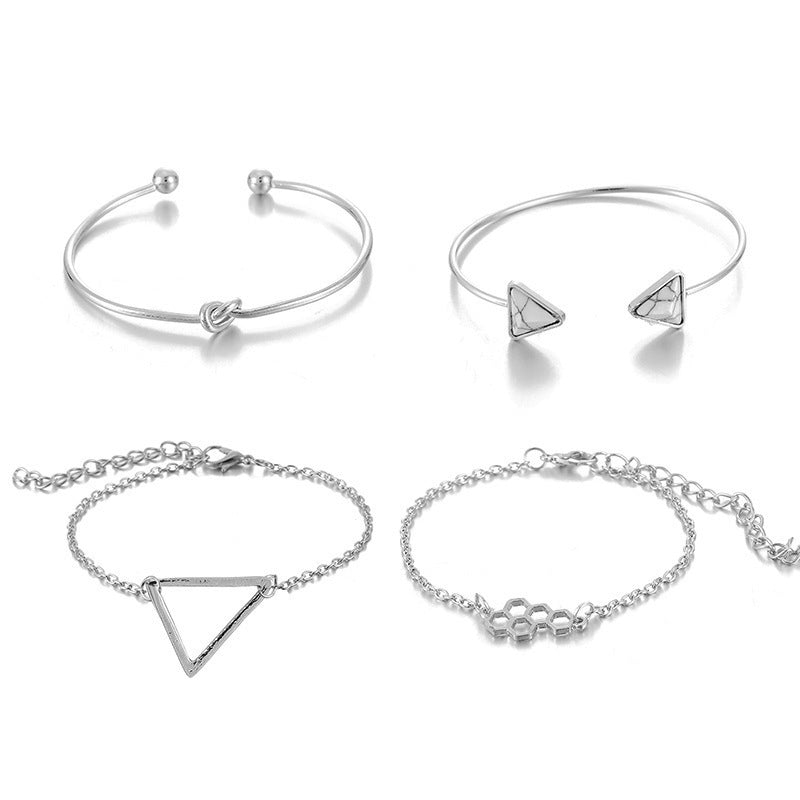 Knotted Triangle Honeycomb Four-piece Bracelet $15.00 Dana Fashion Color: Gold Women's Accessories Product information: Treatment Process: Electroplating Color: Gold Material: Alloy Popular elements: fu character Packing list: Four piece bracelet set * 1