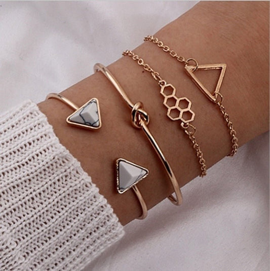 Knotted Triangle Honeycomb Four-piece Bracelet $15.00 Dana Fashion Color: Gold Women's Accessories Product information: Treatment Process: Electroplating Color: Gold Material: Alloy Popular elements: fu character Packing list: Four piece bracelet set * 1