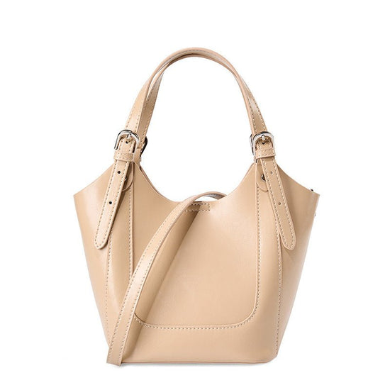 Lake Green Niche Commuter Cowhide Portable Messenger Bag $89.00 Dana Fashion Color: Apricot Women's Bags Product information: Lining texture: polyester cotton Applicable scenario: Daily configuration Color: Black, Milky White, apricot Outer bag type: open