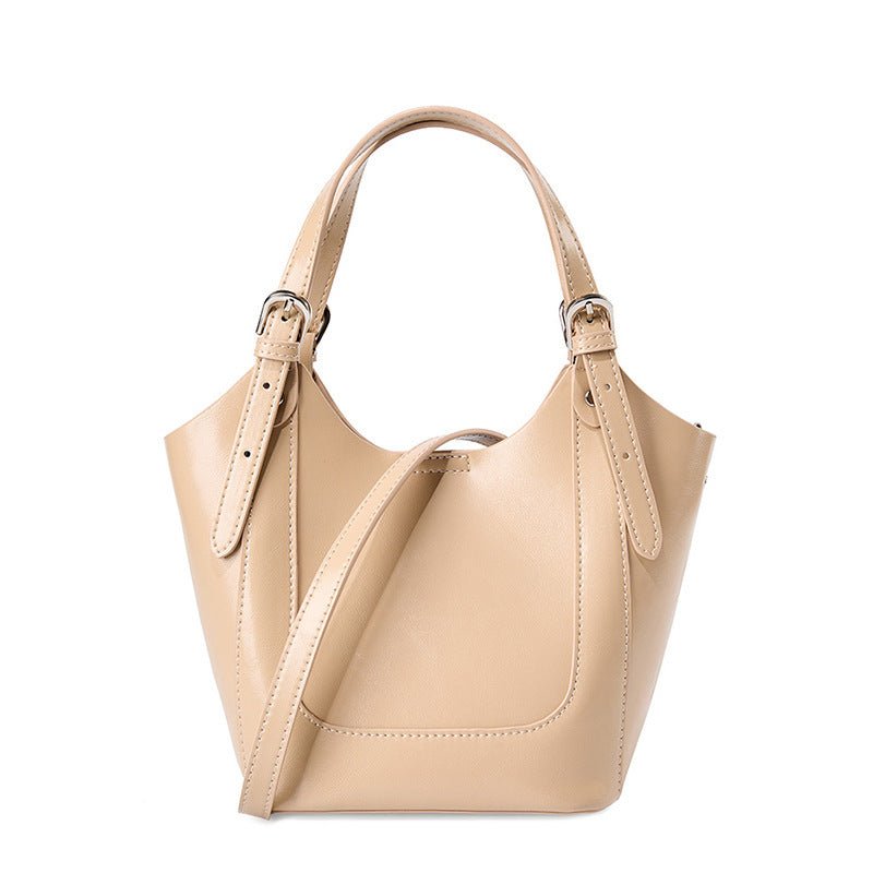 Lake Green Niche Commuter Cowhide Portable Messenger Bag $89.00 Dana Fashion Color: Apricot Women's Bags Product information: Lining texture: polyester cotton Applicable scenario: Daily configuration Color: Black, Milky White, apricot Outer bag type: open