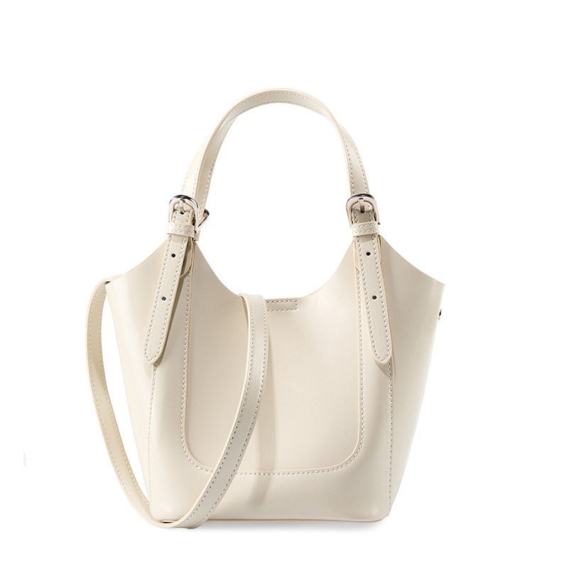 Lake Green Niche Commuter Cowhide Portable Messenger Bag $89.00 Dana Fashion Color: Beige Women's Bags Product information: Lining texture: polyester cotton Applicable scenario: Daily configuration Color: Black, Milky White, apricot Outer bag type: open p