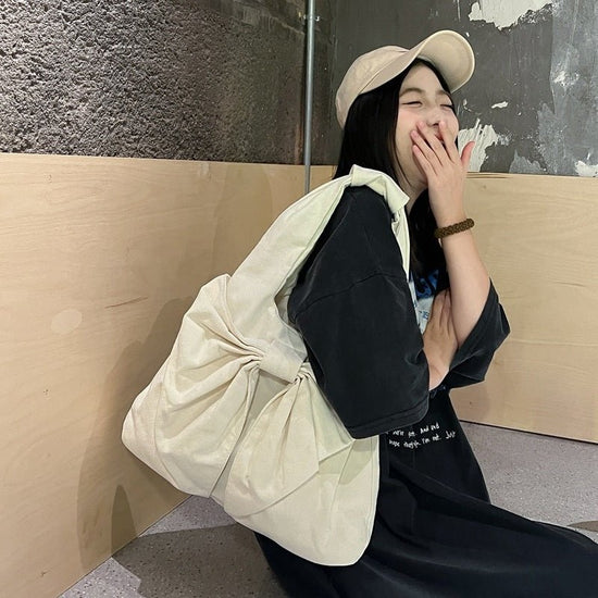 Large Capacity Bow Shoulder Underarm Tote Bag Washed Denim Canvas Bag $44.34 Dana Fashion Color: Beige Women's Bags Product information: Lining texture: polyester cotton Applicable scenario: Daily configuration Color: black, blue, Milky White, dark blue O