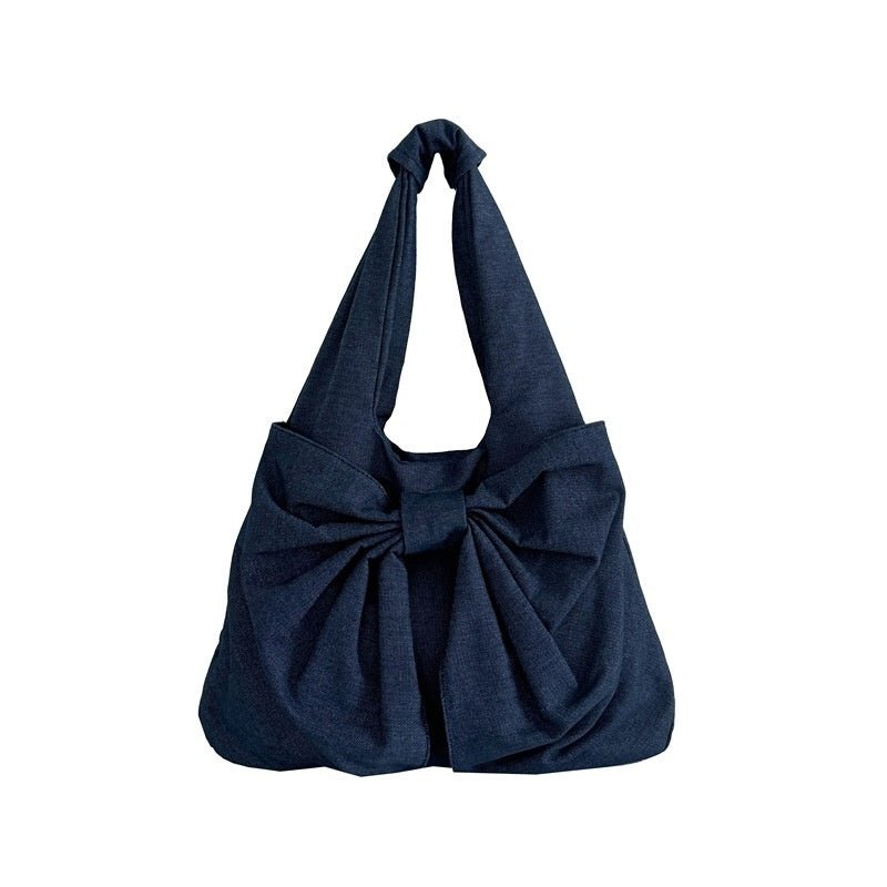 Large Capacity Bow Shoulder Underarm Tote Bag Washed Denim Canvas Bag $44.34 Dana Fashion Color: Beige Women's Bags Product information: Lining texture: polyester cotton Applicable scenario: Daily configuration Color: black, blue, Milky White, dark blue O