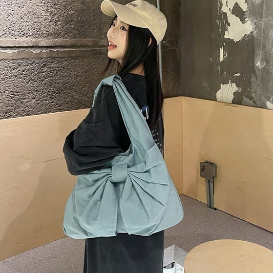 Large Capacity Bow Shoulder Underarm Tote Bag Washed Denim Canvas Bag $44.34 Dana Fashion Color: Beige Women's Bags Product information: Lining texture: polyester cotton Applicable scenario: Daily configuration Color: black, blue, Milky White, dark blue O