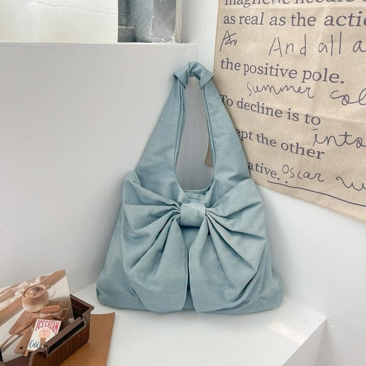 Large Capacity Bow Shoulder Underarm Tote Bag Washed Denim Canvas Bag $44.34 Dana Fashion Color: Beige Women's Bags Product information: Lining texture: polyester cotton Applicable scenario: Daily configuration Color: black, blue, Milky White, dark blue O