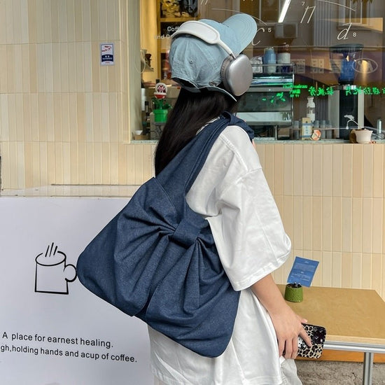 Large Capacity Bow Shoulder Underarm Tote Bag Washed Denim Canvas Bag $44.34 Dana Fashion Color: Beige Women's Bags Product information: Lining texture: polyester cotton Applicable scenario: Daily configuration Color: black, blue, Milky White, dark blue O