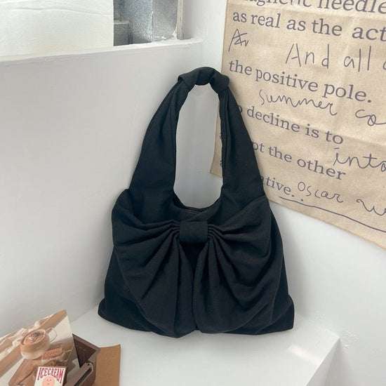 Large Capacity Bow Shoulder Underarm Tote Bag Washed Denim Canvas Bag $44.34 Dana Fashion Color: Black Women's Bags Product information: Lining texture: polyester cotton Applicable scenario: Daily configuration Color: black, blue, Milky White, dark blue O