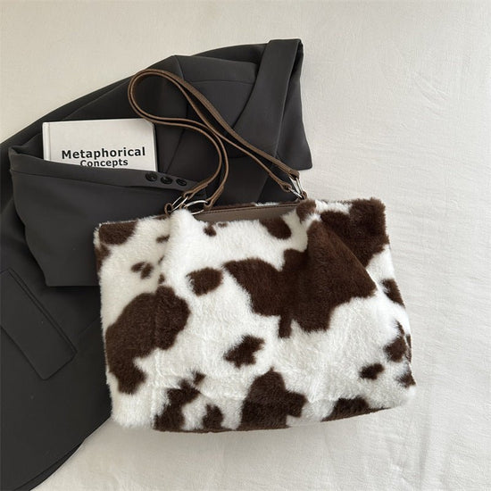 Large Capacity Fur Shoulder Tote Bag $25.00 Dana Fashion Color: Brown Women's Bags Product information: Lining texture: polyester Color: black, brown, pink Hardness: medium and soft Material: Plush Suitcase shape: Horizontal Square Number of shoulder stra