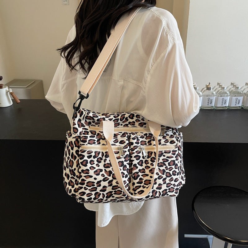 Large Capacity Leopard Print All-match Shoulder Messenger Bag $57.65 Dana Fashion Color: Beige Women's Bags Product information: Lining texture: Polyester Applicable scenario: Daily configuration Color: brown, black, Milky White, pink Hardness: soft Mater
