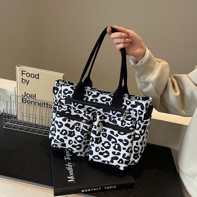 Large Capacity Leopard Print All-match Shoulder Messenger Bag $57.95 Dana Fashion Color: Black Women's Bags Product information: Lining texture: Polyester Applicable scenario: Daily configuration Color: brown, black, Milky White, pink Hardness: soft Mater