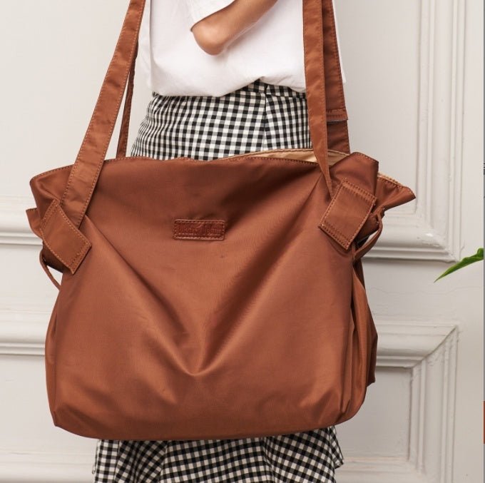 Large Capacity Travel Camping Storage Tote Bag $88.50 Dana Fashion Color: Black Women's Bags Product information: Shoulder strap style: single Backpack mode: one shoulder Shape: horizontal square Material: Oxford cloth Color classification: black, brown P