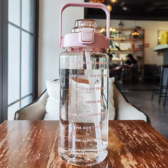 Large Plastic Cup Portable Water Bottle $45.50 Dana Fashion Color: Pink Capacity size: 2000ML Dana's Kitchen Product infor mation: Product category: Large capacity water cup S tyle: Japanese Function: Environmental protection Structure: Single layer Patte