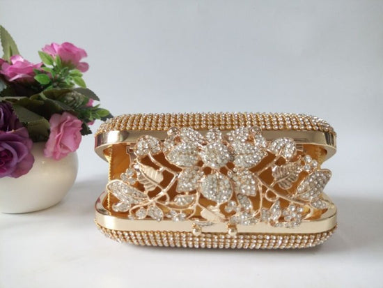Leaf-shaped Flowers Diamond Dinner Clutch $66.86 Dana Fashion Color: Black Women's Bags Product information: Lining texture: Satin Pattern: leaves with diamonds Color: red, black, gold, silver, colorful crystal gold Bag Size: 16cm * 5cm * 12cm (manual mea