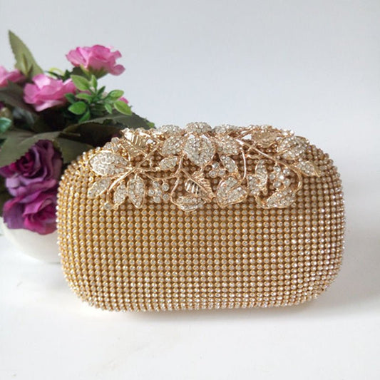Leaf-shaped Flowers Diamond Dinner Clutch $66.86 Dana Fashion Color: Black Women's Bags Product information: Lining texture: Satin Pattern: leaves with diamonds Color: red, black, gold, silver, colorful crystal gold Bag Size: 16cm * 5cm * 12cm (manual mea