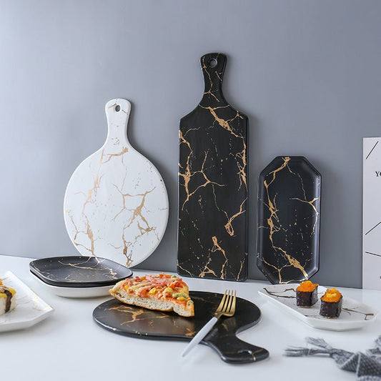 Light luxury style marble and gold irregular ceramic tray $57.78 Dana Fashion Color: 10Style Dana's Kitchen Product name: Nordic marble gold cracked tray Commodity technology: high temperature firing Product material: ceramic Note: The ceramic products ar