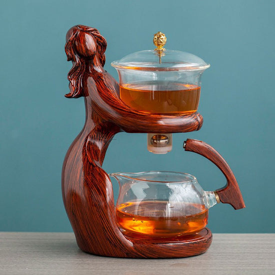 Maid Semi-automatic Tea Set Tea Making Kungfu Teapot Automatic Tea Set Heat-resistant Glass Holder Base Tea Infusers Tea Ware $197.50 Dana Fashion Color: Style1 Dana's Kitchen Overview: MATERIAL: This glass teapot set is made of durable borosilicate glass