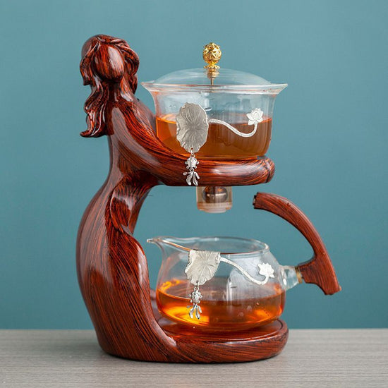 Maid Semi-automatic Tea Set Tea Making Kungfu Teapot Automatic Tea Set Heat-resistant Glass Holder Base Tea Infusers Tea Ware $197.50 Dana Fashion Color: Style7 Dana's Kitchen Overview: MATERIAL: This glass teapot set is made of durable borosilicate glass
