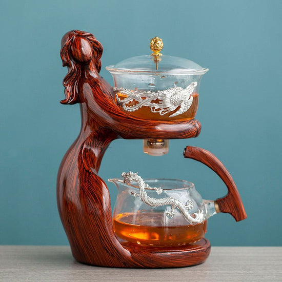 Maid Semi-automatic Tea Set Tea Making Kungfu Teapot Automatic Tea Set Heat-resistant Glass Holder Base Tea Infusers Tea Ware $197.50 Dana Fashion Color: Style9 Dana's Kitchen Overview: MATERIAL: This glass teapot set is made of durable borosilicate glass