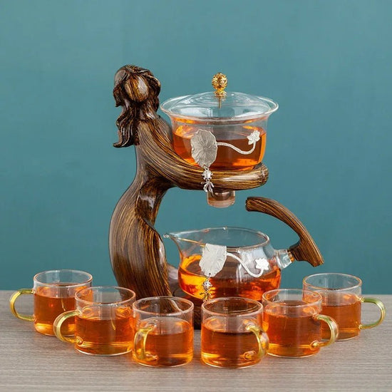 Maid Semi-automatic Tea Set Tea Making Kungfu Teapot Automatic Tea Set Heat-resistant Glass Holder Base Tea Infusers Tea Ware $197.50 Dana Fashion Color: Style1 Dana's Kitchen Overview: MATERIAL: This glass teapot set is made of durable borosilicate glass