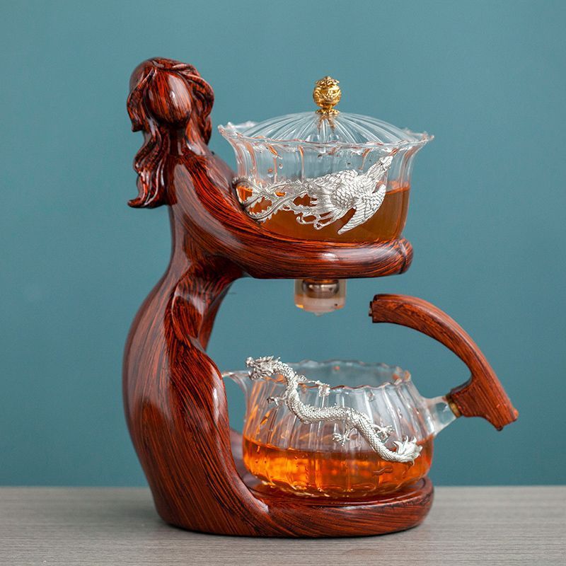 Maid Semi-automatic Tea Set Tea Making Kungfu Teapot Automatic Tea Set Heat-resistant Glass Holder Base Tea Infusers Tea Ware $197.50 Dana Fashion Color: Style10 Dana's Kitchen Overview: MATERIAL: This glass teapot set is made of durable borosilicate glas