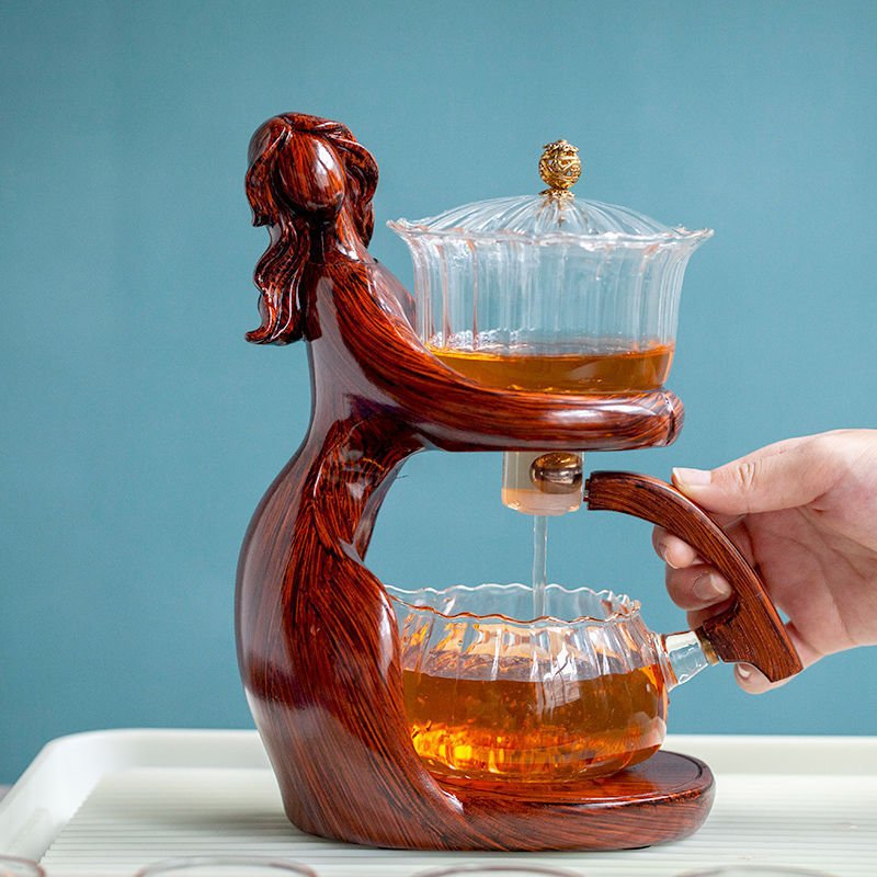 Maid Semi-automatic Tea Set Tea Making Kungfu Teapot Automatic Tea Set Heat-resistant Glass Holder Base Tea Infusers Tea Ware $197.50 Dana Fashion Color: Style3 Dana's Kitchen Overview: MATERIAL: This glass teapot set is made of durable borosilicate glass