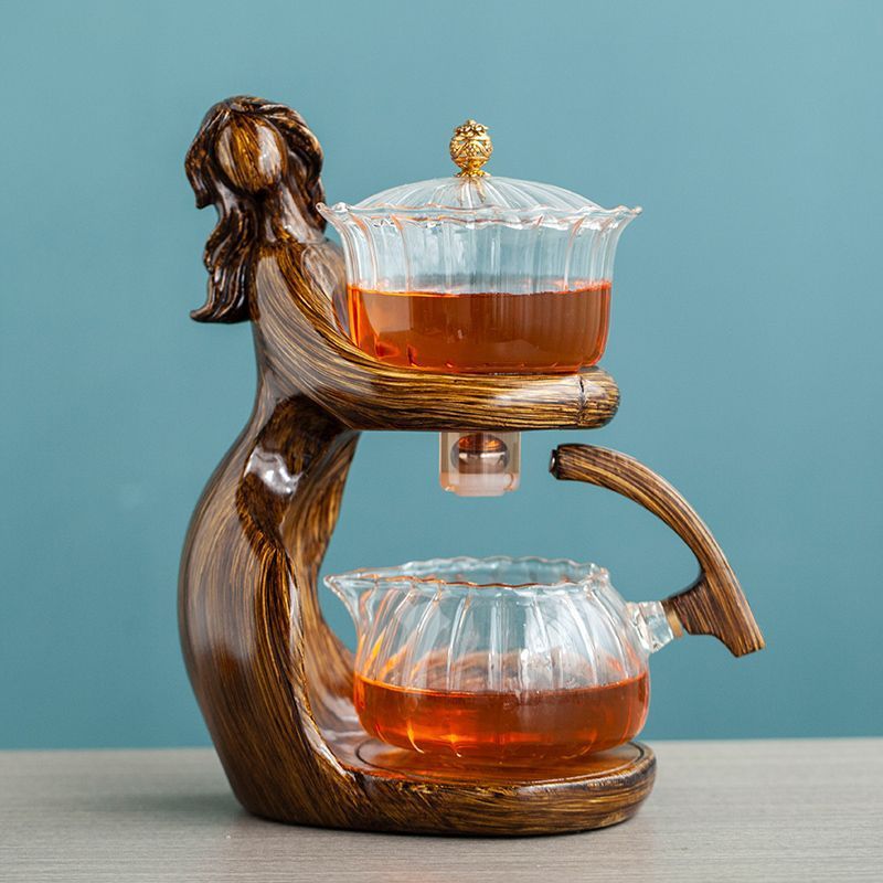 Maid Semi-automatic Tea Set Tea Making Kungfu Teapot Automatic Tea Set Heat-resistant Glass Holder Base Tea Infusers Tea Ware $197.50 Dana Fashion Color: Style4 Dana's Kitchen Overview: MATERIAL: This glass teapot set is made of durable borosilicate glass