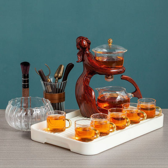 Maid Semi-automatic Tea Set Tea Making Kungfu Teapot Automatic Tea Set Heat-resistant Glass Holder Base Tea Infusers Tea Ware $197.50 Dana Fashion Color: Style1 Dana's Kitchen Overview: MATERIAL: This glass teapot set is made of durable borosilicate glass