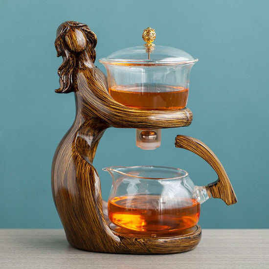 Maid Semi-automatic Tea Set Tea Making Kungfu Teapot Automatic Tea Set Heat-resistant Glass Holder Base Tea Infusers Tea Ware $197.50 Dana Fashion Color: Style2 Dana's Kitchen Overview: MATERIAL: This glass teapot set is made of durable borosilicate glass