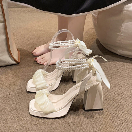 Medium Chunky Heel Crystal French Style Fairy Pearl Roman Sandals $39.50 Dana Fashion Color: Beige Size: 35 Women's shoes Product information: Lining material: no lining Toe holder shape: square head Color: beige 8cm], black upgraded version [8cm]] Shoe U