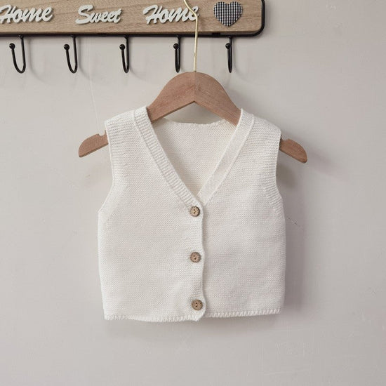 Men's And Women's Solid Color Knitted Base Vest Cardigan $24.89 Dana Fashion Color: Brown Child size: 100cm Baby Clothing Product Information: Yarn thickness: fine wool Thickness: General Sleeve length: long sleeve Closed style: single-breasted Pattern: p