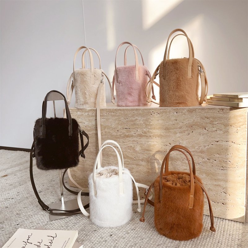 Mink-like Bucket Vintage Plush Hand Bag $45.52 Dana Fashion Color: Apricot Size: 14X28X14cm Women's Bags Product information: Color: black, light brown, caramel, pink, apricot, White Applicable Gender: Female Hardness: medium Material: mink-shaped Suitcas