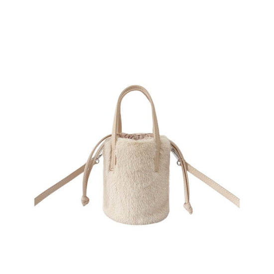 Mink-like Bucket Vintage Plush Hand Bag $45.52 Dana Fashion Color: Apricot Size: 14X28X14cm Women's Bags Product information: Color: black, light brown, caramel, pink, apricot, White Applicable Gender: Female Hardness: medium Material: mink-shaped Suitcas
