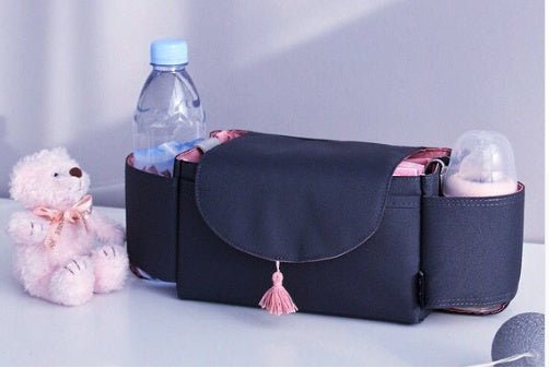Multifunction Baby Stroller Bag Organizer Maternity Nappy Bag Stroller Accessories Cup wheelchair bag $47.20 Dana Fashion Color: Pink fringe Baby & Mother Overview: The trolley storage bag can hold baby's diapers, feeding bottles, wallet and mobile phone,