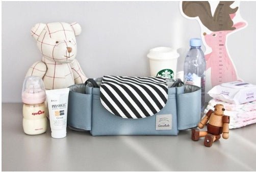 Multifunction Baby Stroller Bag Organizer Maternity Nappy Bag Stroller Accessories Cup wheelchair bag $29.33 Dana Fashion Color: Black stripe Baby & Mother Overview: The trolley storage bag can hold baby's diapers, feeding bottles, wallet and mobile phone