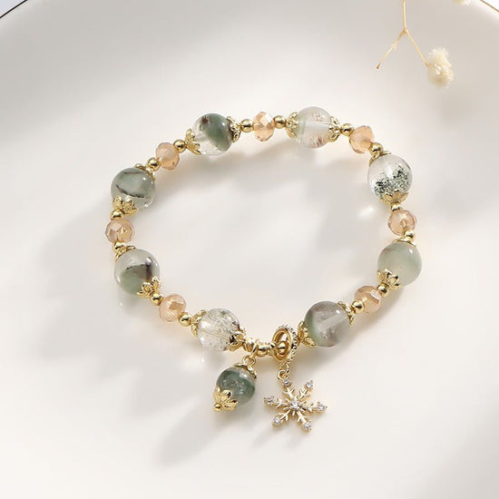 Natural Chorite Crystals Crystal Bracelet Female Snowflake Pendant $25.00 Dana Fashion Color: Green Phantom Quartz Bracelet Women's Accessories Product information: Color: 3A green Phantom quartz bracelet Style: Women's Material: Crystal Shape: Wave Size: