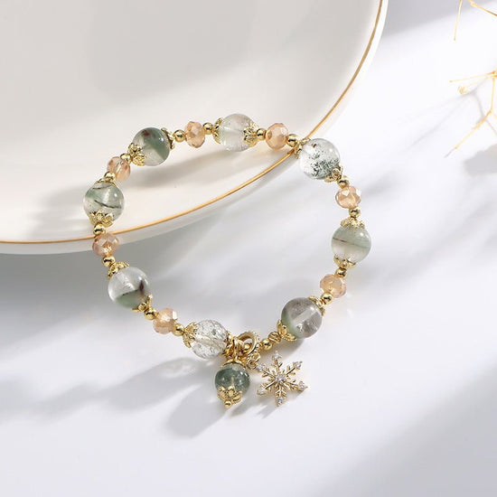 Natural Chorite Crystals Crystal Bracelet Female Snowflake Pendant $25.00 Dana Fashion Color: Green Phantom Quartz Bracelet Women's Accessories Product information: Color: 3A green Phantom quartz bracelet Style: Women's Material: Crystal Shape: Wave Size:
