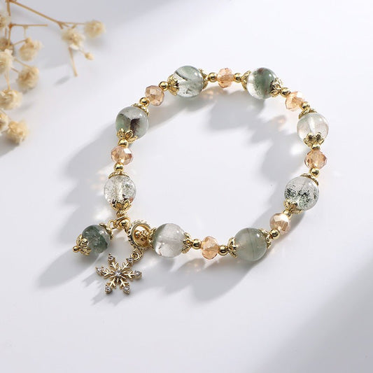 Natural Chorite Crystals Crystal Bracelet Female Snowflake Pendant $25.00 Dana Fashion Color: Green Phantom Quartz Bracelet Women's Accessories Product information: Color: 3A green Phantom quartz bracelet Style: Women's Material: Crystal Shape: Wave Size: